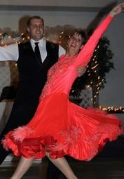 Carol Fox poses after performing a quickstep with Timothy Nyman, owner of Black Tie Dance Studio in Sandusky. Carol, a friend of the Port Clinton mayor and her instructor won the Judge's Choice trophy in the second annual Ottawa County Stars Dance for CASA on Saturday night in Oak Harbor.